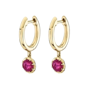 Macro detail of gold hoop earrings with multi-prong set round pink zircon crystals