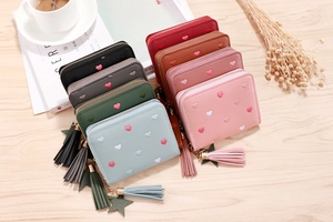 Short PU leather women's wallets with heart embroidery and tassel star charms