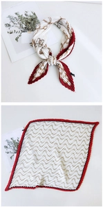 Red and white pleated silk scarf showing the elegant chain pattern and wave textures