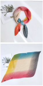 Close-up of rainbow gradient pleated silk scarf with fine accordion pleats texture