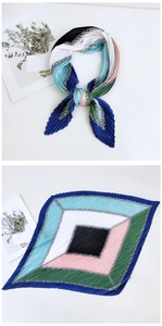 Detail of pleated silk scarf with colorful geometric patterns and chain print
