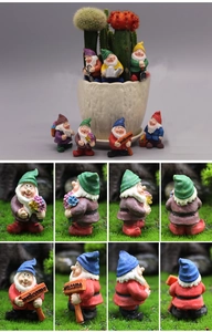 Miniature garden gnome set with welcome sign and tools for moss micro landscapes