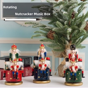 Detailed macro view of three colorful nutcracker wooden music boxes in a festive setting