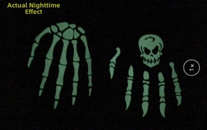 Luminous green skull and skeletal hand gloves glowing in the dark for Halloween