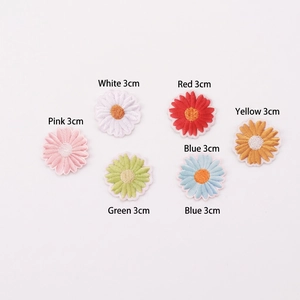 Detailed view of six 3cm self-adhesive daisy flower embroidery patches in mixed colors