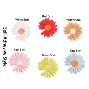Detailed view of six colorful self-adhesive daisy flower embroidery patches in 5cm diameter