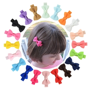 Set of 20 handmade colorful ribbon bow hair clips for girls including model wearing display