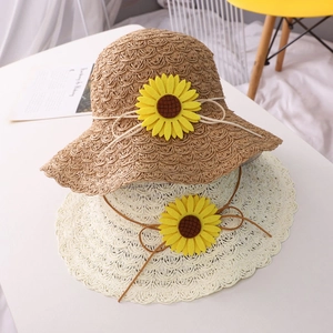 Handmade crochet straw sun hats in khaki and cream with yellow sunflower ornaments