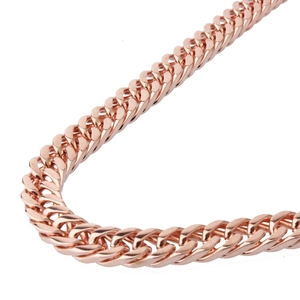 Macro shot of 8mm rose gold double-woven stainless steel chain with polished finish