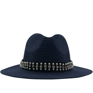 Navy blue straw fedora hat with wide brim featuring pearl and rhinestone ribbon decoration