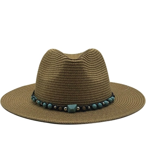 Brown straw Panama hat with turquoise bead band decoration and wide brim for sun protection