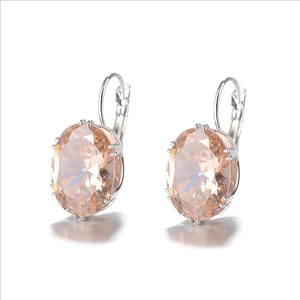 Detail of champagne oval-cut gemstone leverback earrings in silver-tone setting