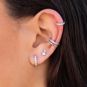 Elegant S925 silver stud earrings with opal and cubic zirconia in a stacked ear curation