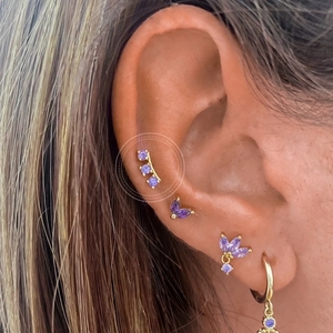 S925 silver gold earrings set with purple zircon crystals shown on a model