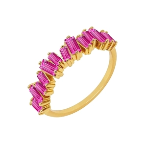 Macro shot of rectangular pink zircons on a wavy gold ring band with high shine finish