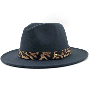 Detailed view of dark grey wool fedora featuring leopard print band and gold stud accent