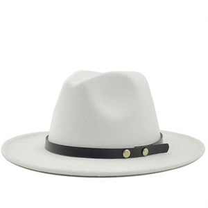 Detail of white wool fedora hat featuring black leather band and golden metal rivets