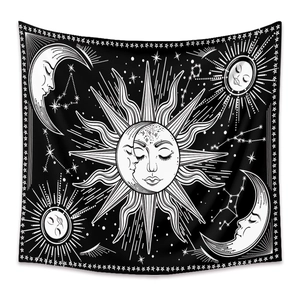 Detailed view of bohemian tapestry featuring sun and moon zodiac patterns in black and white