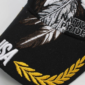 Close-up of USA and Native Pride embroidery on a black camouflage baseball cap