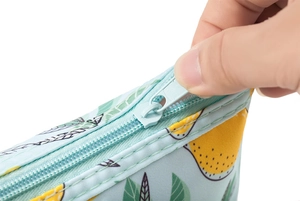 Detail showing the smooth zipper action and stitching on the lemon print makeup bag