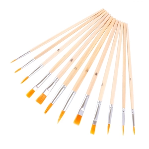 Set of 12 nylon oil paint brushes with wooden handles in a fan layout on white background