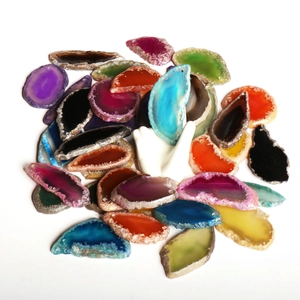 Colorful natural agate slices pile with translucent texture and raw crystal edges