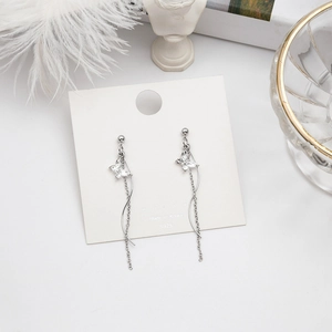 Detail of S925 silver butterfly tassel earrings with sparkling crystals and long S-shaped chains