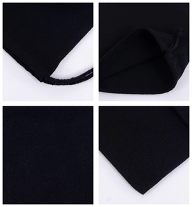 Detail view of black canvas drawstring pouch showing fabric texture and stitching