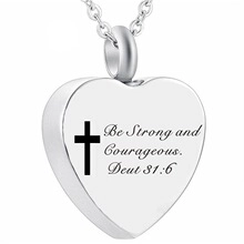 Detail of silver heart urn pendant with engraved cross and Deuteronomy 31:6 scripture