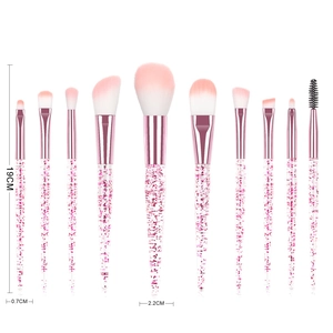 Detail of 10-piece makeup brush set with glitter-filled transparent handles and soft bristles