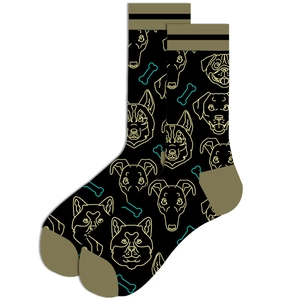 Close-up of black crew socks featuring yellow dog and bone patterns with contrast toe