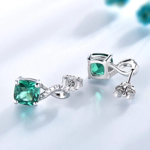 Elegant S925 sterling silver drop earrings featuring emerald-cut green gemstones and diamonds