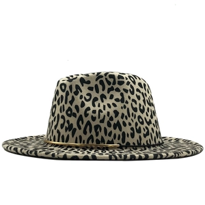 Detail of leopard print wool fedora with beige base and elegant gold metal bar accent