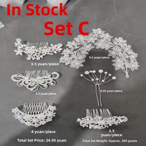 Detail view of 5-piece bridal hair comb set with pearls, rhinestones and silver flowers