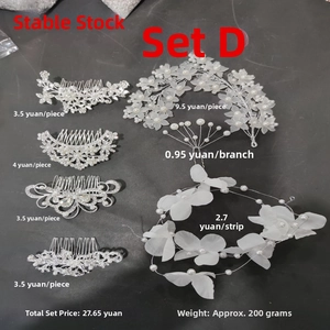 Detailed set of silver bridal hair accessories with pearls, crystals and flower patterns