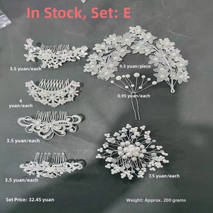 Detail view of a 7-piece bridal hair jewelry set with pearls and rhinestones on hair combs