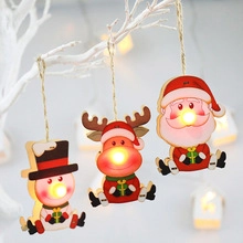 Three wooden Christmas ornaments featuring Santa and Snowman with glowing LED noses