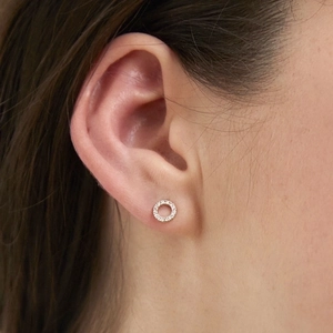 Elegant gold-plated circular earrings with cubic zirconia pavé setting on ear