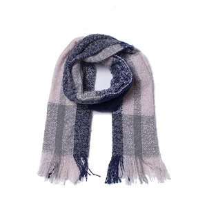 Detail of pink and blue plaid scarf with soft knitted texture and decorative fringe trim