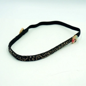 Sparkling black rhinestone headband with ear-saving buttons and elastic strap