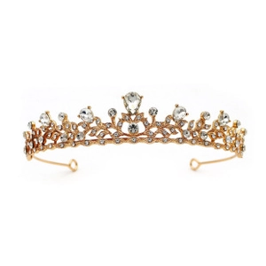 Detail of golden princess tiara with hollow leaf design and teardrop rhinestone center