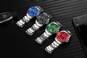 Detail view of four luxury quartz watches with colorful dials and stainless steel bands