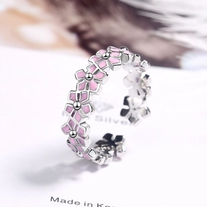 Floral silver open ring with pink enamel flower petals and adjustable band design
