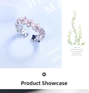 Detail of floral adjustable ring with pink enamel flowers and silver polished finish