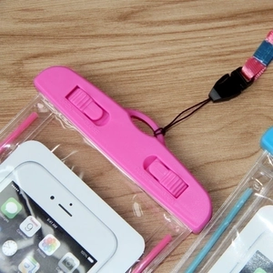 Waterproof phone pouch with dual lock system and lanyard in pink and blue colors