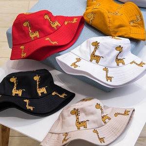 Kids cotton giraffe bucket hats in five colors including red, yellow, white, and black