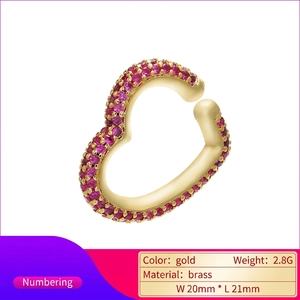 Golden heart-shaped ear cuff with pave pink zircon stones in brass material