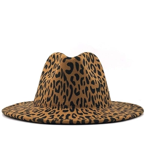 Detailed view of the leopard print fedora hat featuring a classic wide flat brim style