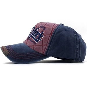 Close-up of vintage cotton baseball cap with New York embroidery and distressed brim edge