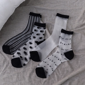 Set of four sheer mesh summer socks with black stripes, hearts, and polka dots patterns